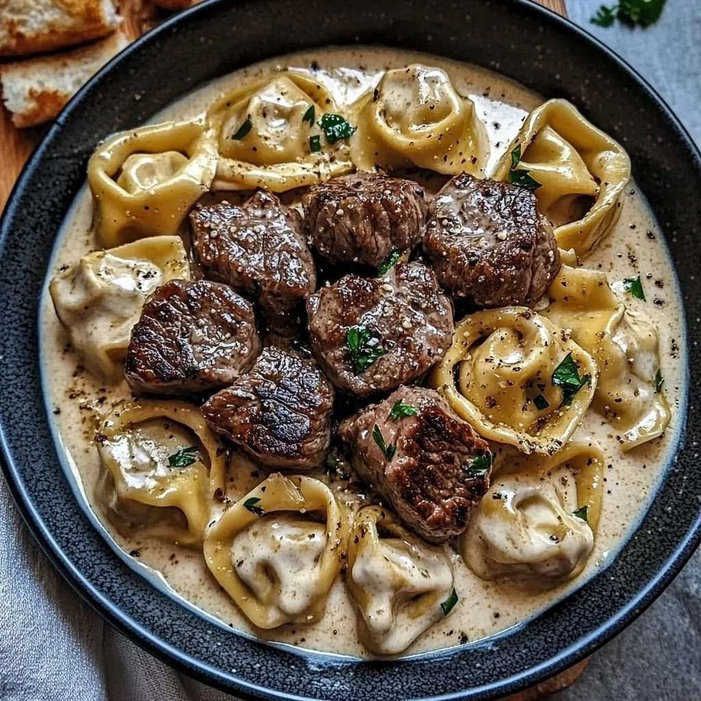 Cracked Garlic Steak Tortellini dish served with garlic sauce.