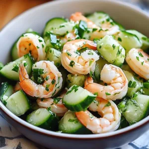 Healthy cucumber shrimp salad with fresh vegetables and dressing